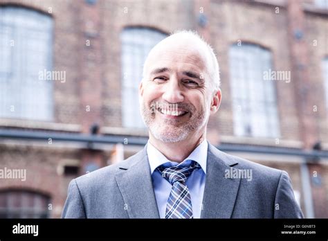 Mature Businessman Smiling Portrait Stock Photo Alamy