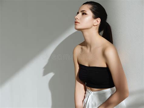 Attractive Brunette With A Pigtail On Her Head Fashion Glamor Studio Stock Photo Image Of