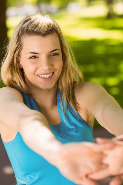 Premium Photo Fit Blonde Stretching In The Park