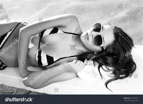 Стоковая фотография 165107225 Sexy Girl Bikini Lying Near Swimming
