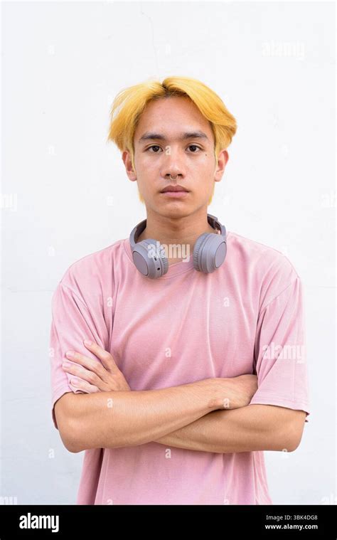 Thai Gay Teen Man With Pink Shirt And Septum Ring Against White Background Stock Photo Alamy