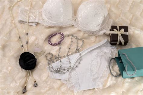 Seductive White Lingerie With Gift Box On Beige Cloth Stock Image