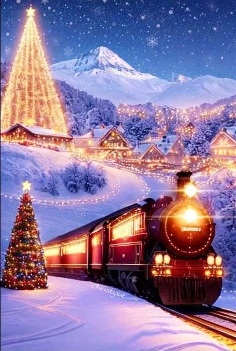 A Christmas Train Is Coming Down The Tracks In Front Of A Snowy