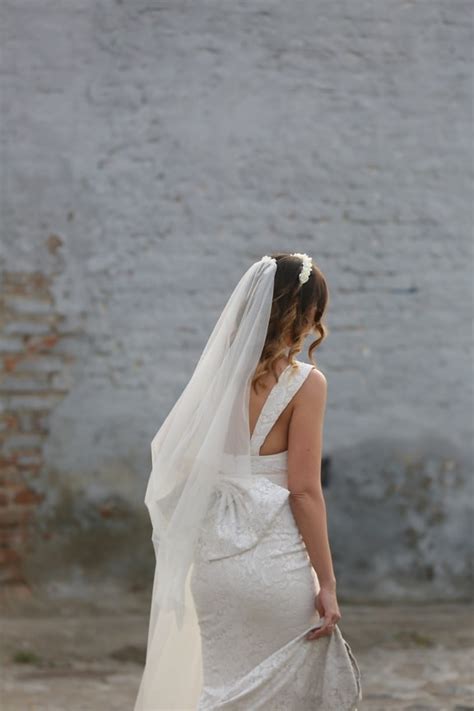 picture wedding dress bride girlfriend helping attractive