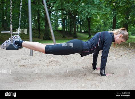 young woman exercising  swing stock photo alamy