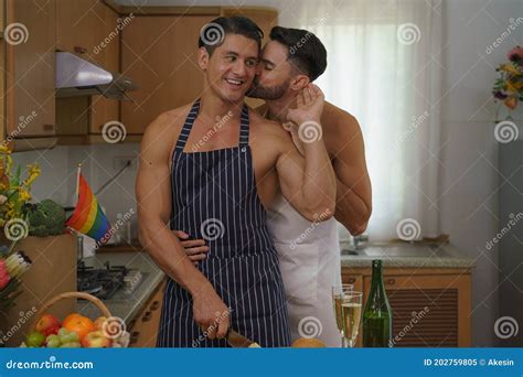Caucasian Lgbtq Gay Couple Enjoying Cooking Food Together In Kitchen Stock Image Image Of