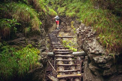 Premium Photo Hiker Walking Hard Way Through The Canyon