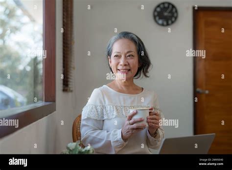 Smart Asian Mature Middle Aged Businesswoman Ceo Boss Leader Teacher Using Tablet E Learning