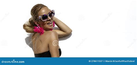 Elegant Woman Is Wearing Luxury Sunglasses Jewelry And Bikini And Is Posing On White Background