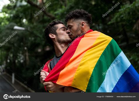 Gay Couple Kissing Rainbow Flag Park Stock Photo By Gustavofrazao