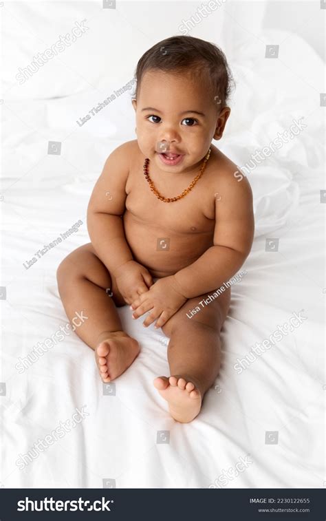 Smiling Naked Baby Sitting On Bed Stock Photo Shutterstock
