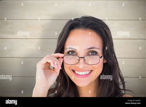 Composite Image Of Pretty Brunette Wearing Glasses Stock Photo Alamy