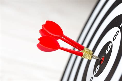 Premium Photo Target Dart Arrow Hitting In The Target Center Of Dartboard