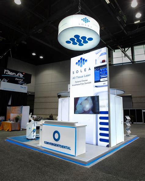 20x20 Trade Show Exhibit With Backlit Tower and Raised Exhibit Flooring
