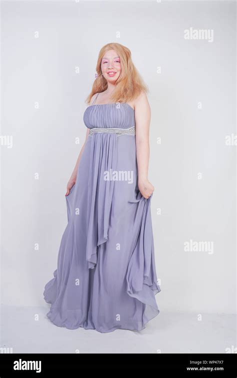 Cute Fashion Lady With Asian Face And Blonde Hair In Gray Dress Stock