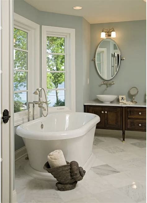 A Bathroom With A Large Tub And Two Sinks In It S Center Along With A