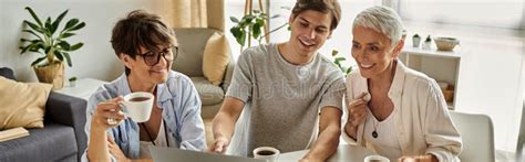 Lesbian Parents Share Laughter And Coffee Stock Photo Image Of Pride Heartfelt