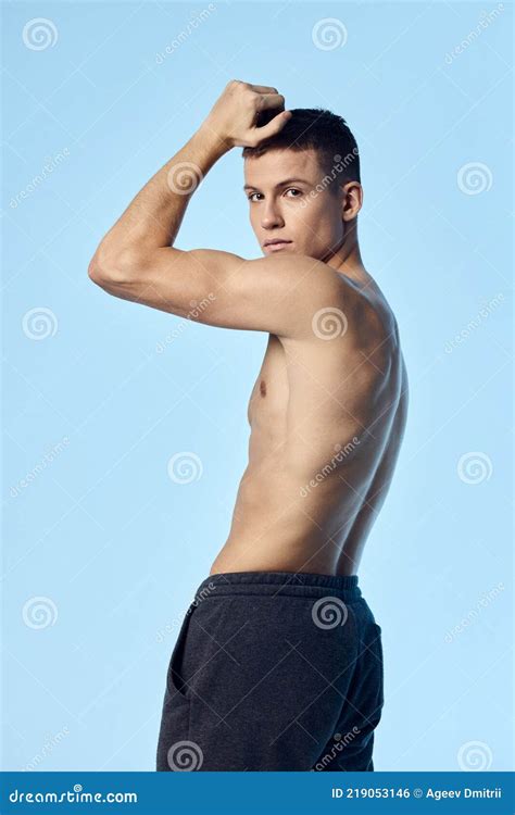 Man With Naked Torso Holds Hands Near The Face Sport Fitness Back View