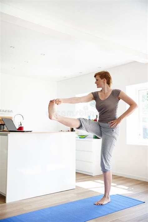 Getting The Posture Right An Attractive Woman Doing Yoga In Her Home