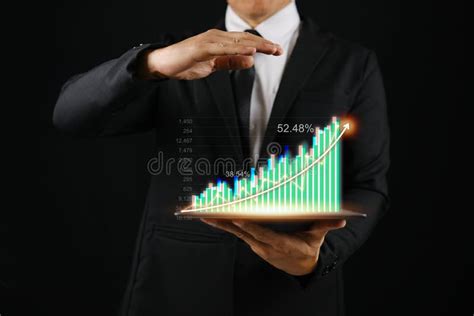 Businessman Holding Tablet Showing Realistic Hologram Stock Photo