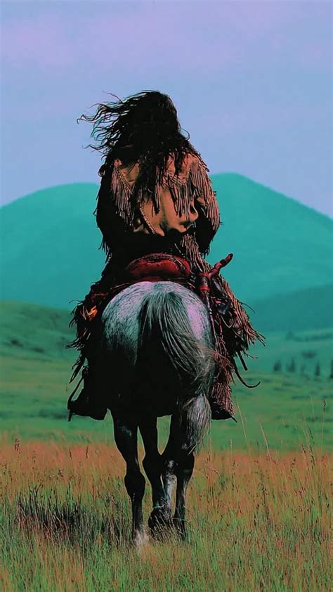 A horseback rider galloping in open grassy plains. Untamed adventurous ...