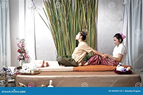 Thai Masseuse Doing Massage For Woman In Spa Salon Asian Beautiful Woman Getting Thai Herbal