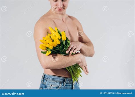 Man Man With Naked Torso Gives Flowers Romantic Man With Bouquet Of Tulips For Birthday Happy