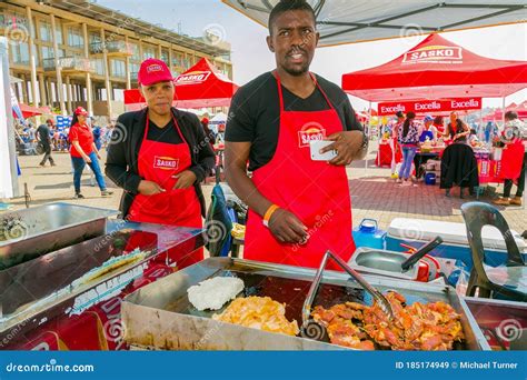 diverse african vendors cooking  serving  bread based street