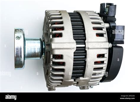New modern car power generator with clutch pulley shaft on a white ...
