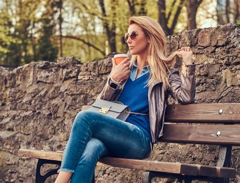 Premium Photo Fashionable Blonde Female Relaxes Outdoor Drinking