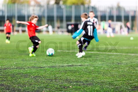 Blur Of Young Boys Playing Soccer Match Stock Image Colourbox