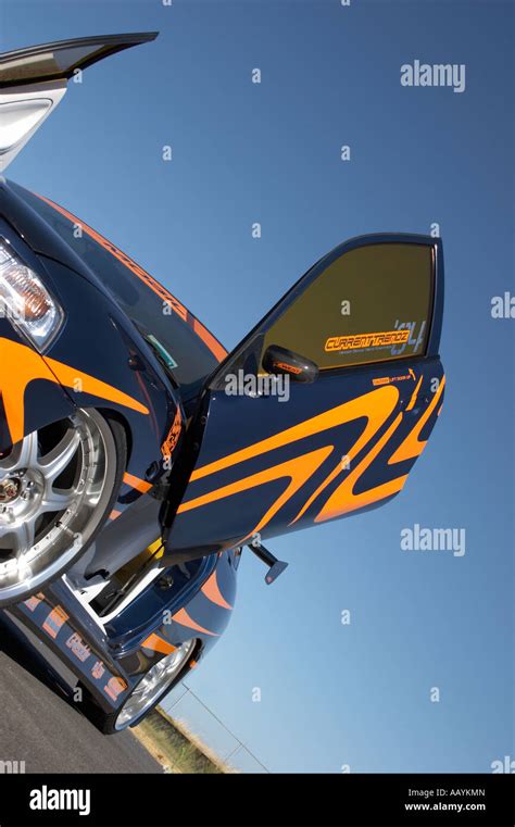 artistic slanted photography angle on the gull wing door of a tuned and ...