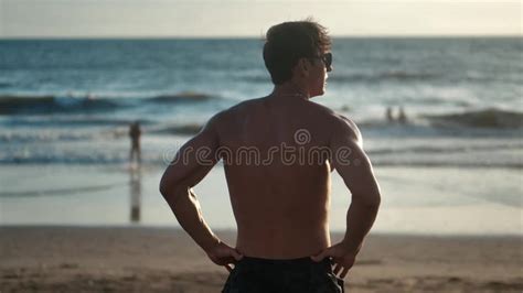 Portrait Of Muscular Man With A Naked Torso On The Beach At Sunset Stock Video Video Of