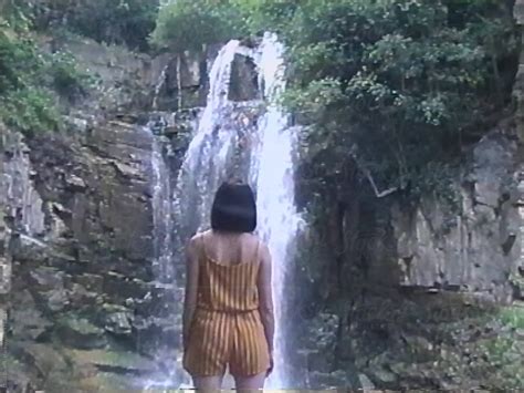 Amateur Shooting On A VHS Camera To A Girl Near A Waterfall By Stocksy Contributor Dima