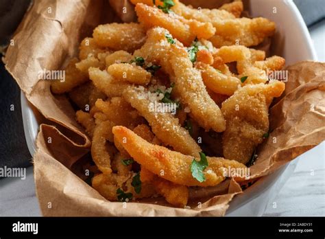 New England Fried Clam Strips Served With A Bowl Of Tartar Dipping