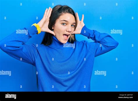Young Brunette Girl Wearing Turtleneck Sweater Smiling Cheerful Playing