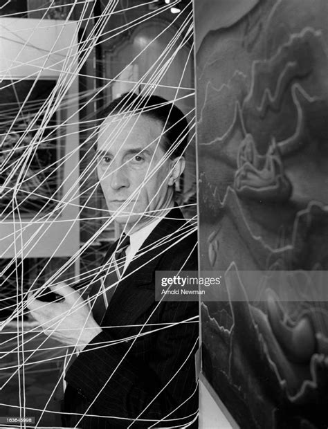 Portrait Of French Born Artist Marcel Duchamp Seen Behind A Small News Photo Getty Images