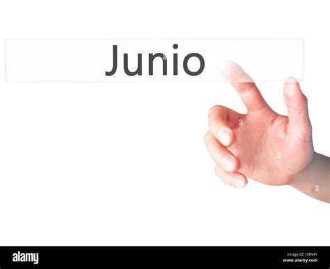 junio june  spanish hand pressing  button  blurred background