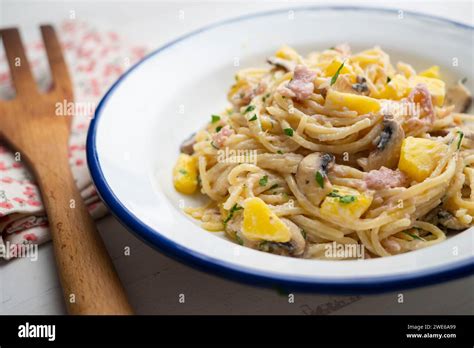 Spaghetti Carbonara With Mushrooms Ham And Pineapple Stock Photo Alamy