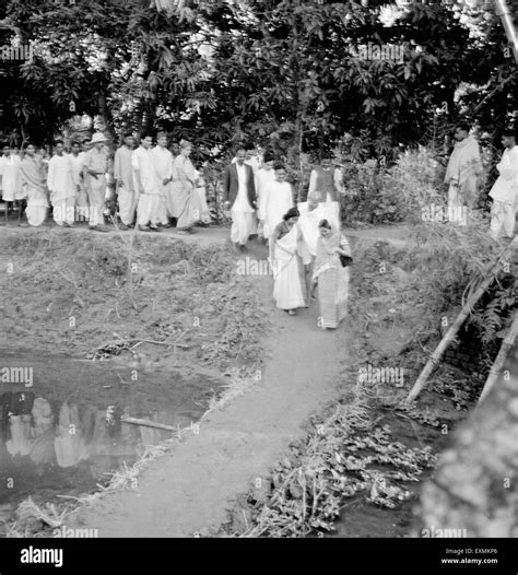 Mahatma Gandhi And His Party Passing A Dam While Being Through Effected