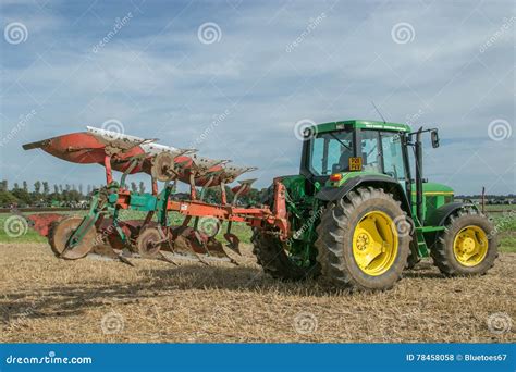 Vintage John Deere Tractor Pulling A Plough Editorial Stock Photo