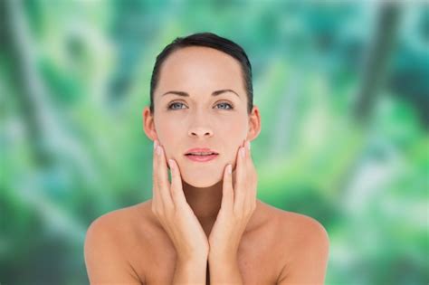 Premium Photo Beautiful Nude Brunette Posing With Hands On Face