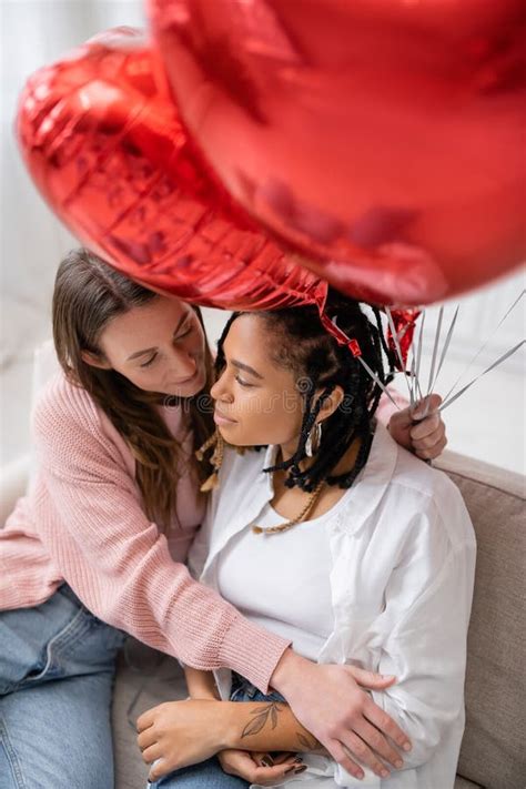 Overhead View Of Lesbian Woman Holding Stock Image Image Of Sofa