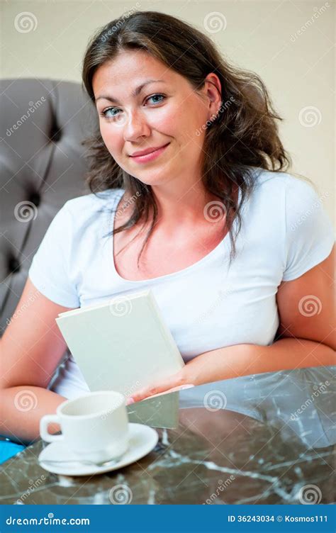 Portrait Of A Beautiful Brunette In A Chair At The Table Stock Photo Image Of Cheerful Human