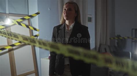 Blonde Woman Detective Investigates Indoor Crime Scene With Handgun And Caution Tape Stock Video