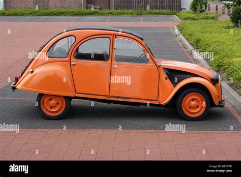 Orange Painted Old Timer Citroen 2cv Stock Photo Alamy