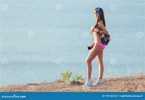 Side View Of Attractive Girl In Headphones And Pink Bikini Looking Stock Photo Image Of Person