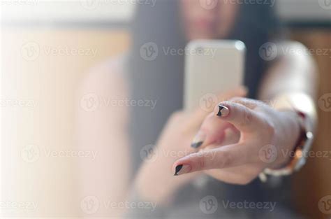 The Brunette Girl Takes Pictures Of Her Two Fingers On A Modern 15650607 Stock Photo At Vecteezy