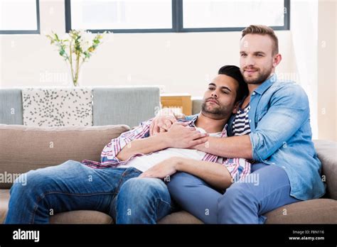 Gay Couple Relaxing On The Couch Stock Photo Alamy