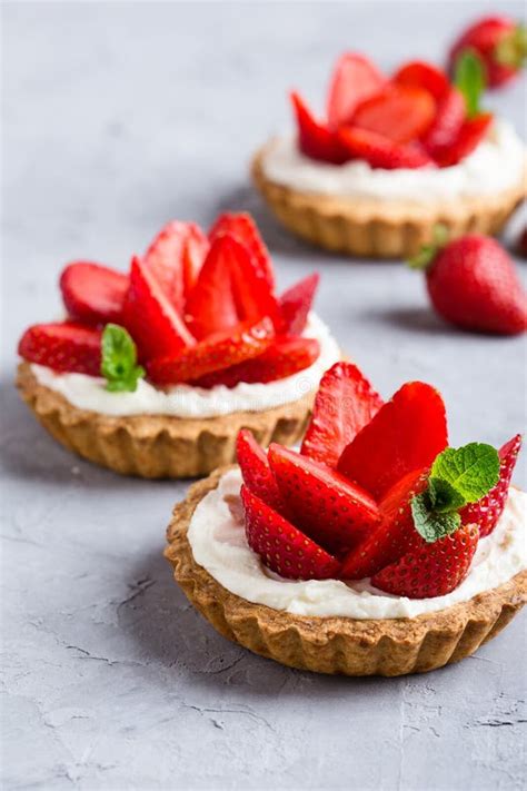 Strawberry Vanilla Cream Cheese Tarts Over Light Gray Table Stock Image